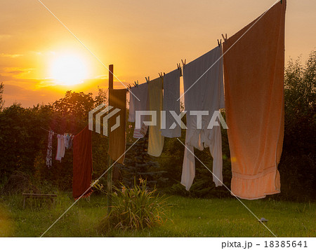 White laundry is drying outside White laundry is drying outside 18385641