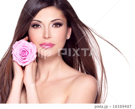 beautiful pretty woman with long hair and pink rose at face. 18389487