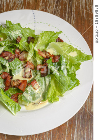 Fresh caesar salad served on table backgckground Fresh caesar salad served on table backgckground 18389858