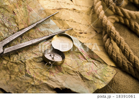 Compass on the old paper background Compass on the old paper background 18391061