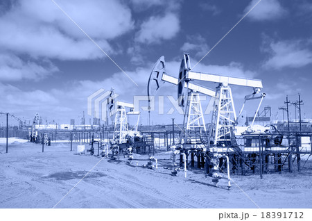Pump jack on a oilfield. Toned. 18391712