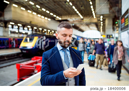 Businessman with smart phone Businessman with smart phone 18400006