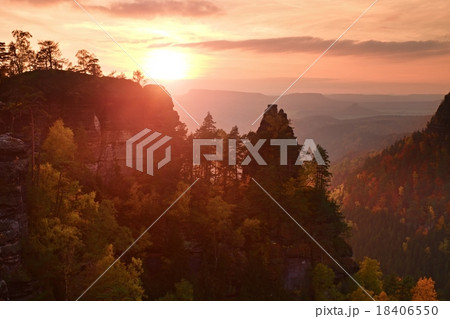 Autumn sunset in rocks. Rocks above fall valley 18406550