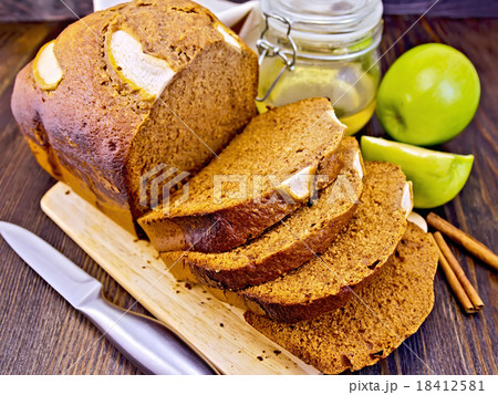 Bread apple with honey on dark board Bread apple with honey on dark board 18412581