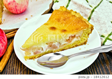 Pie apple with sour cream on dark board Pie apple with sour cream on dark board 18412612
