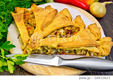 Pie with cabbage and sorrel on board 18412621