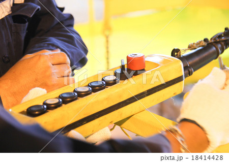 Lifting remote on hand worker Lifting remote on hand worker 18414428