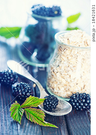 oat flakes with black berries oat flakes with black berries 18421631