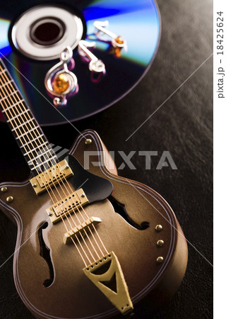 Guitar and CD, bright colorful vivid theme Guitar and CD, bright colorful vivid theme 18425624