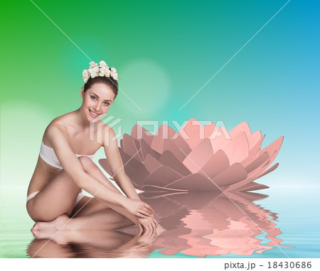 Young woman with lotus and stones 18430686