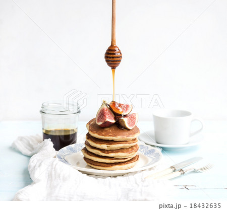 Pancake tower with fresh figs and honey on a 18432635