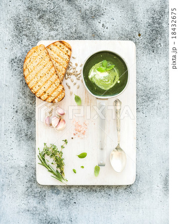 Homemade green spinach cream-soup in a metal scoop 18432675