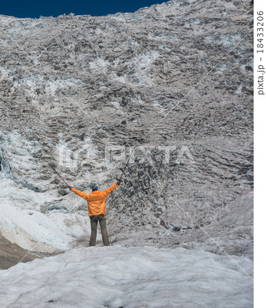 hiker looks at icefall 18433206