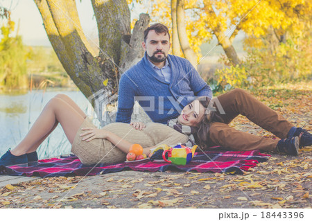 Happy young couple on the picnic in autumn park 18443396