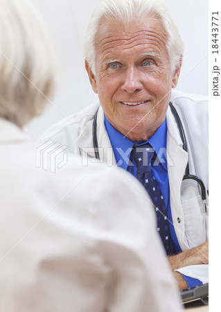 Senior Male Doctor With Female Patient Senior Male Doctor With Female Patient 18443771