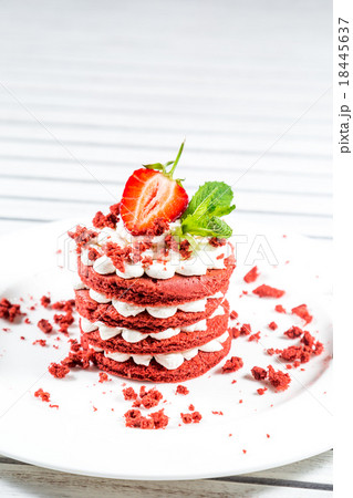 Delicious red cake with cream and berries close up Delicious red cake with cream and berries close up 18445637