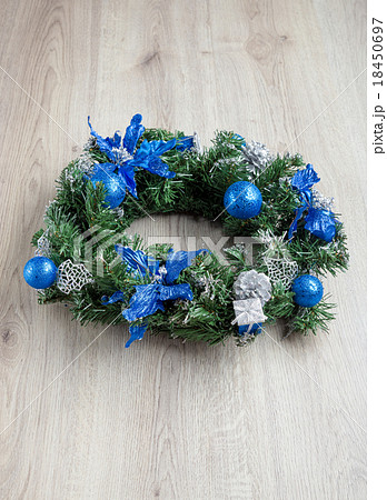 Christmas blue wreath on wood Christmas blue wreath on wood 18450697