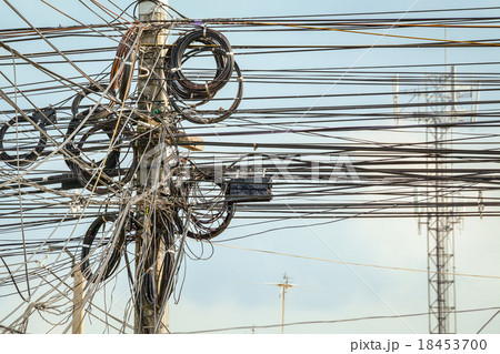 lot of wire cables messy on electricity pole  18453700