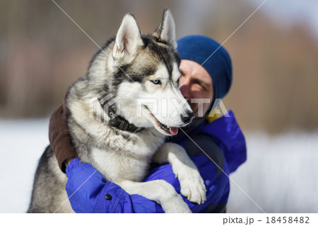 Happy man with a husky 18458482