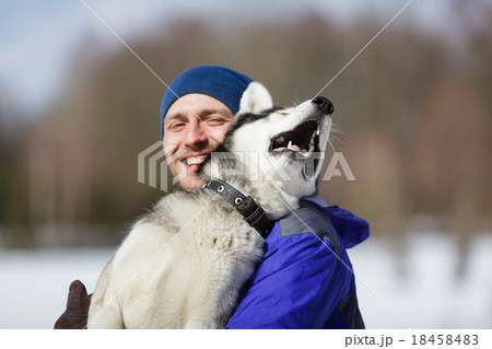 Happy man with a husky 18458483