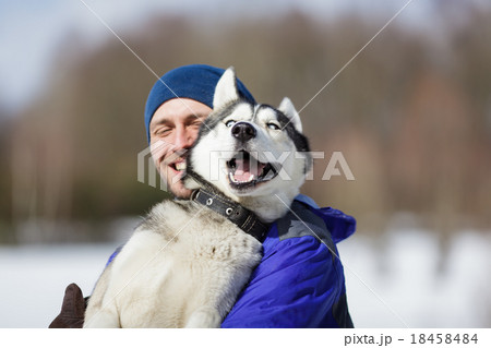 Happy man with a husky 18458484