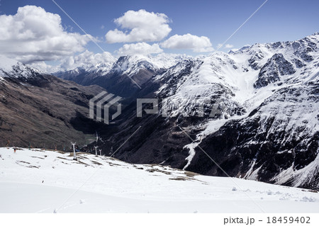 view of the valley between three mountain ranges 18459402