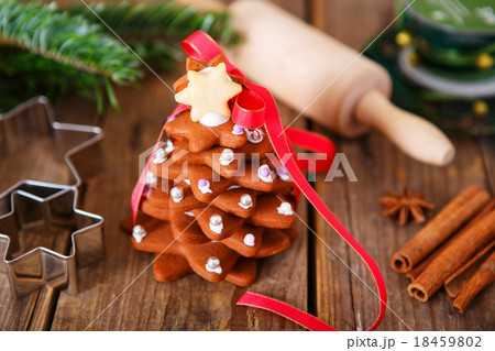 Homemade baked Christmas gingerbread tree on vintage wooden back Homemade baked Christmas gingerbread tree on vintage wooden back 18459802