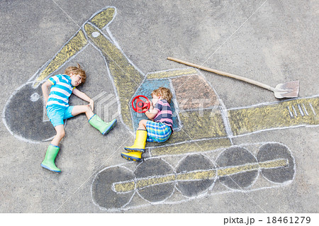 Two little kid boys with excavator chalk picture 18461279