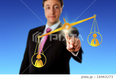Female Worker Outbalancing A Male On A Scale 18463273