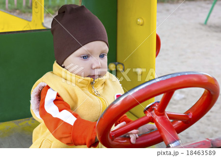 One year boy in toy car 18463589