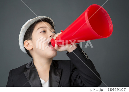 Little asian boy using megaphone shouting 18469107