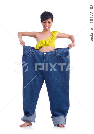 Woman in dieting concept with big jeans Woman in dieting concept with big jeans 18472282