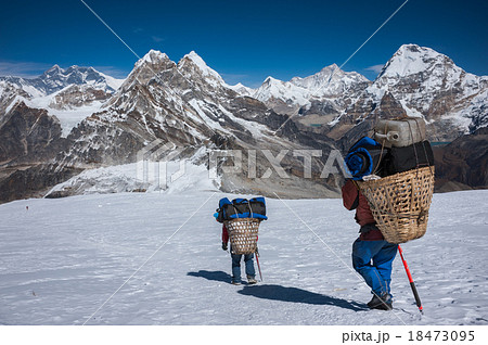 Porter carrying heavy loads to Mera peak high camp Porter carrying heavy loads to Mera peak high camp 18473095