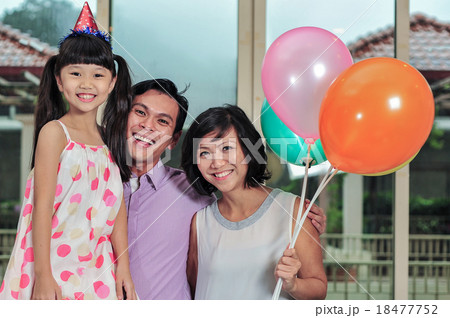 Young Asian mother and daughter kissed father Young Asian mother and daughter kissed father 18477752
