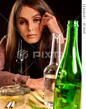 Drunk girl holding bottle of vodka. Drunk girl holding bottle of vodka. 18480632