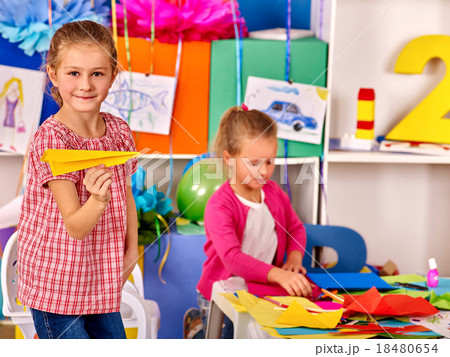 Group kids make origami airplane in kindergarten . 18480654