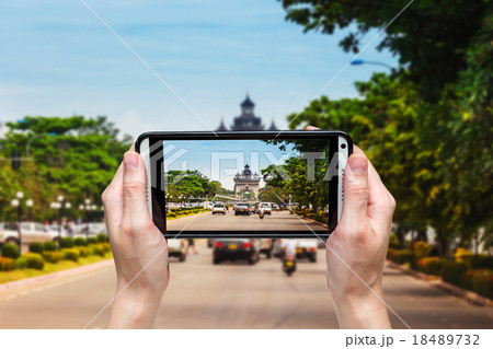 Hand woman taking phoot at victory Gate Patuxai Hand woman taking phoot at victory Gate Patuxai 18489732