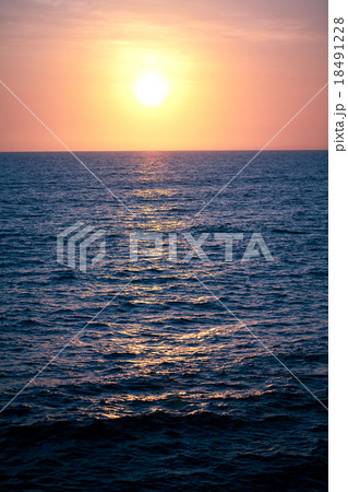 Calm peaceful ocean and beach on tropical sunrise. Calm peaceful ocean and beach on tropical sunrise. 18491228
