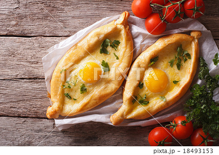 Adjarian khachapuri and vegetables top view 18493153