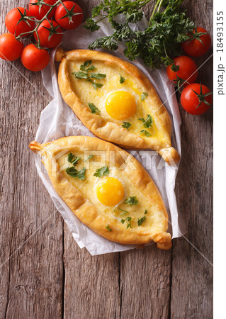 Georgian khachapuri and fresh vegetables top view 18493155