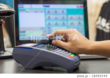 Hand Swiping Credit Card In Store 18493549