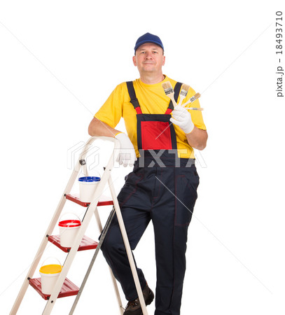 Worker on ladder with brush. Worker on ladder with brush. 18493710