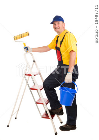 Worker on ladder with roller. Worker on ladder with roller. 18493711
