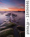 orange sunset over natural Rock line formation 18494446