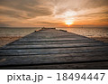 wooden jetty facing sun set down 18494447