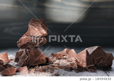 Chocolate pieces on a dark backround 18494830