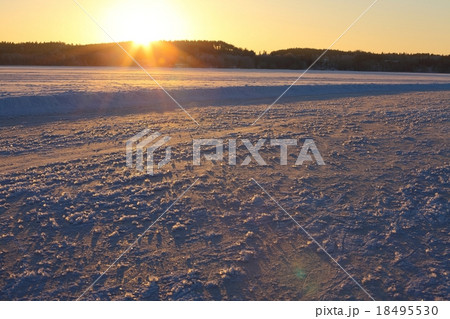 Frozen lake sunset 18495530