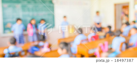 blur kids and teacher in the classroom. 18497387