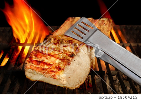 Big Chop Of Pork Ribs On The Flaming BBQ Grill Big Chop Of Pork Ribs On The Flaming BBQ Grill 18504215