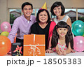 Grandma wearing a party hat at her birthday party 18505383
